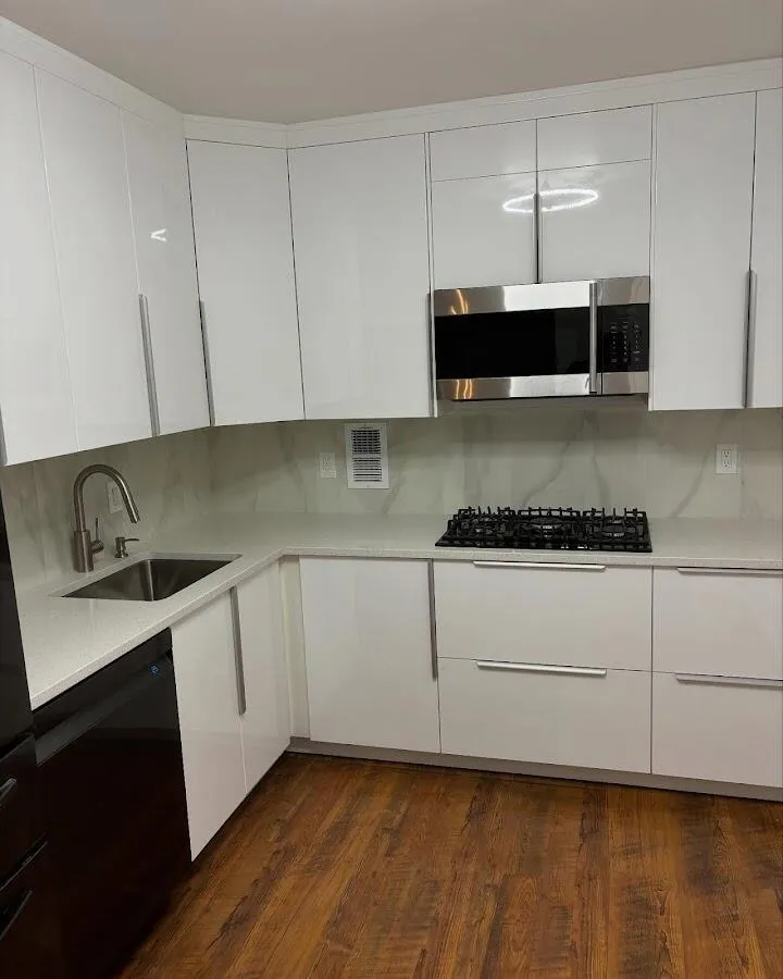 Restored kitchen with white cabinets after water damage in Boston